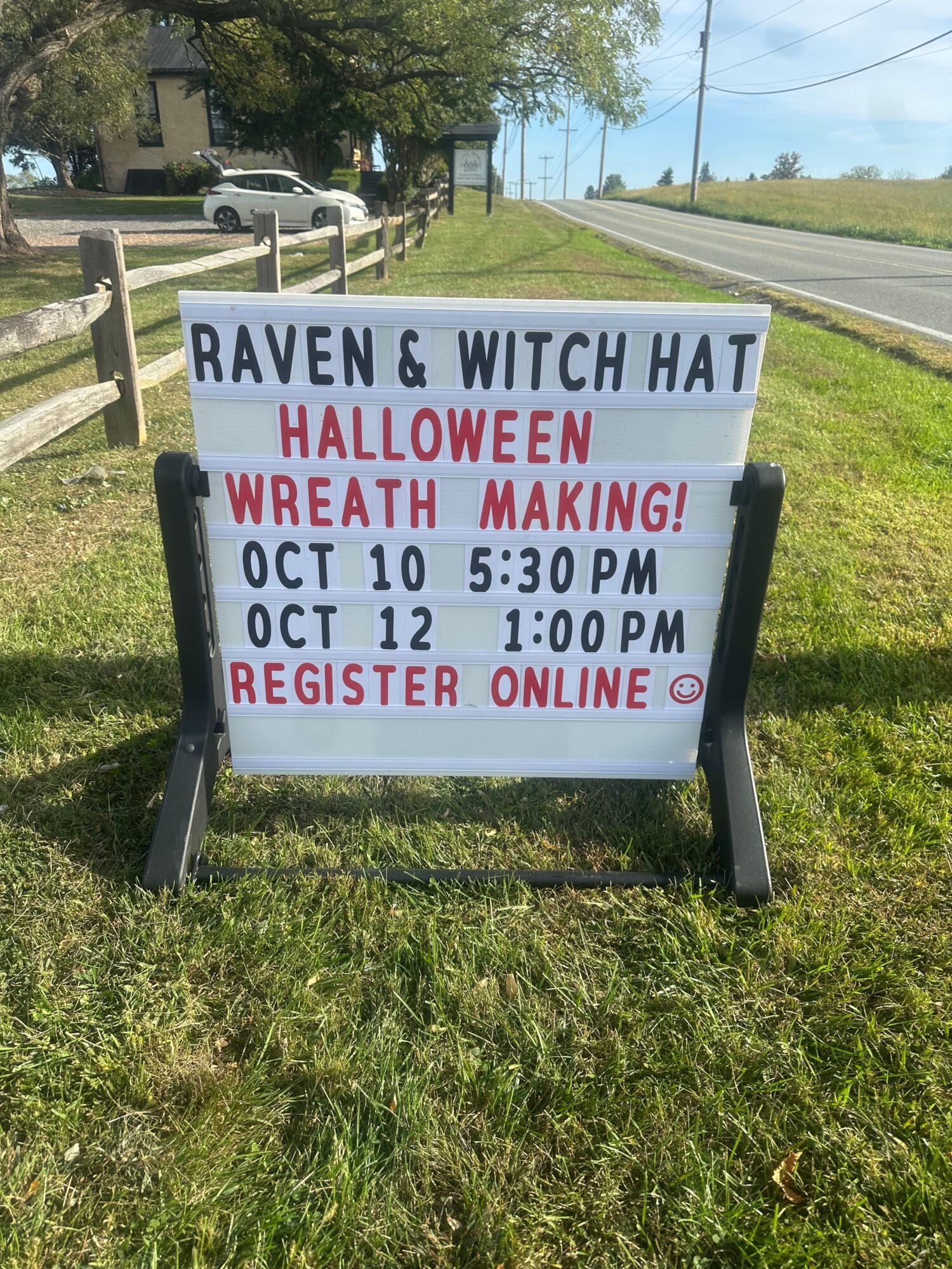 Signboard advertising Halloween event at Raven & Witch Hat, October 12, 2023, 5:30 PM, online registration required.