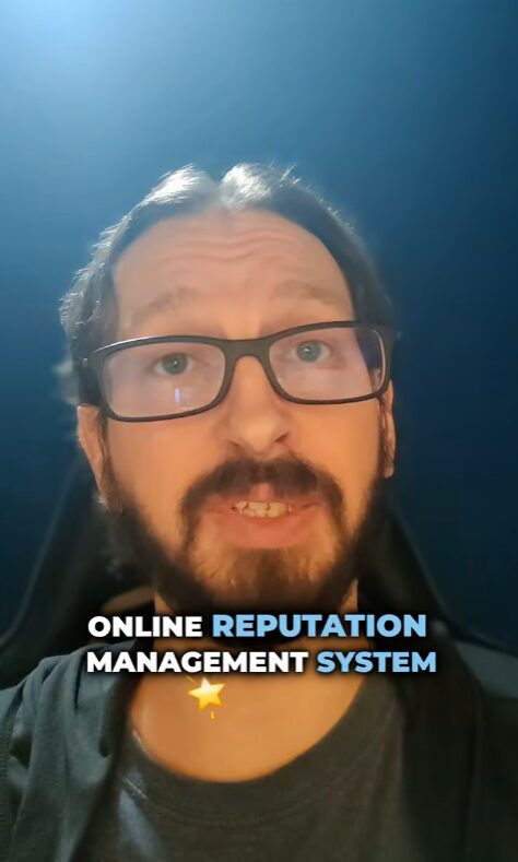Man with glasses and beard smiling, dark background, text overlay about online reputation management system, 20 words.