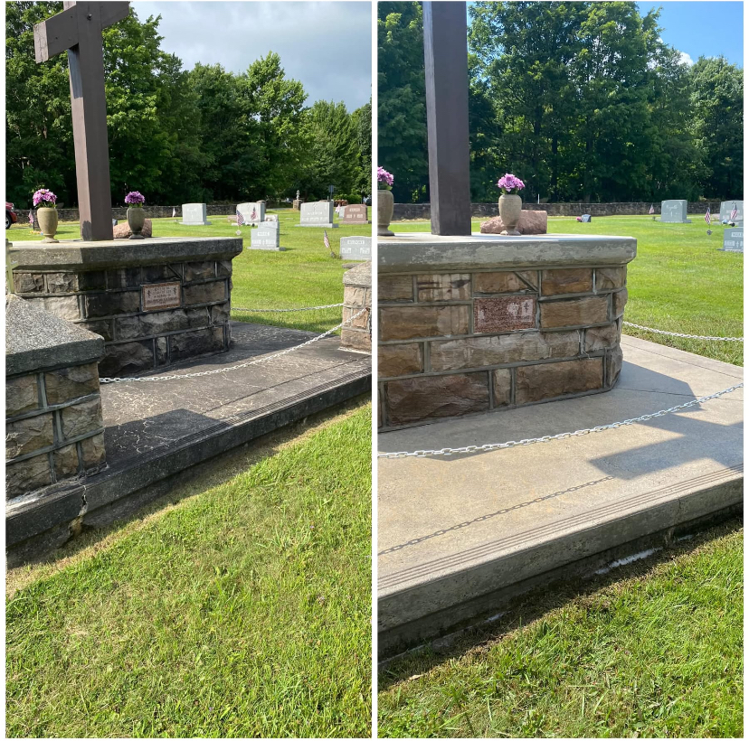 Side-by-side view of a stone monument with a concrete base, surrounded by grass and trees, with a cemetery in the background.