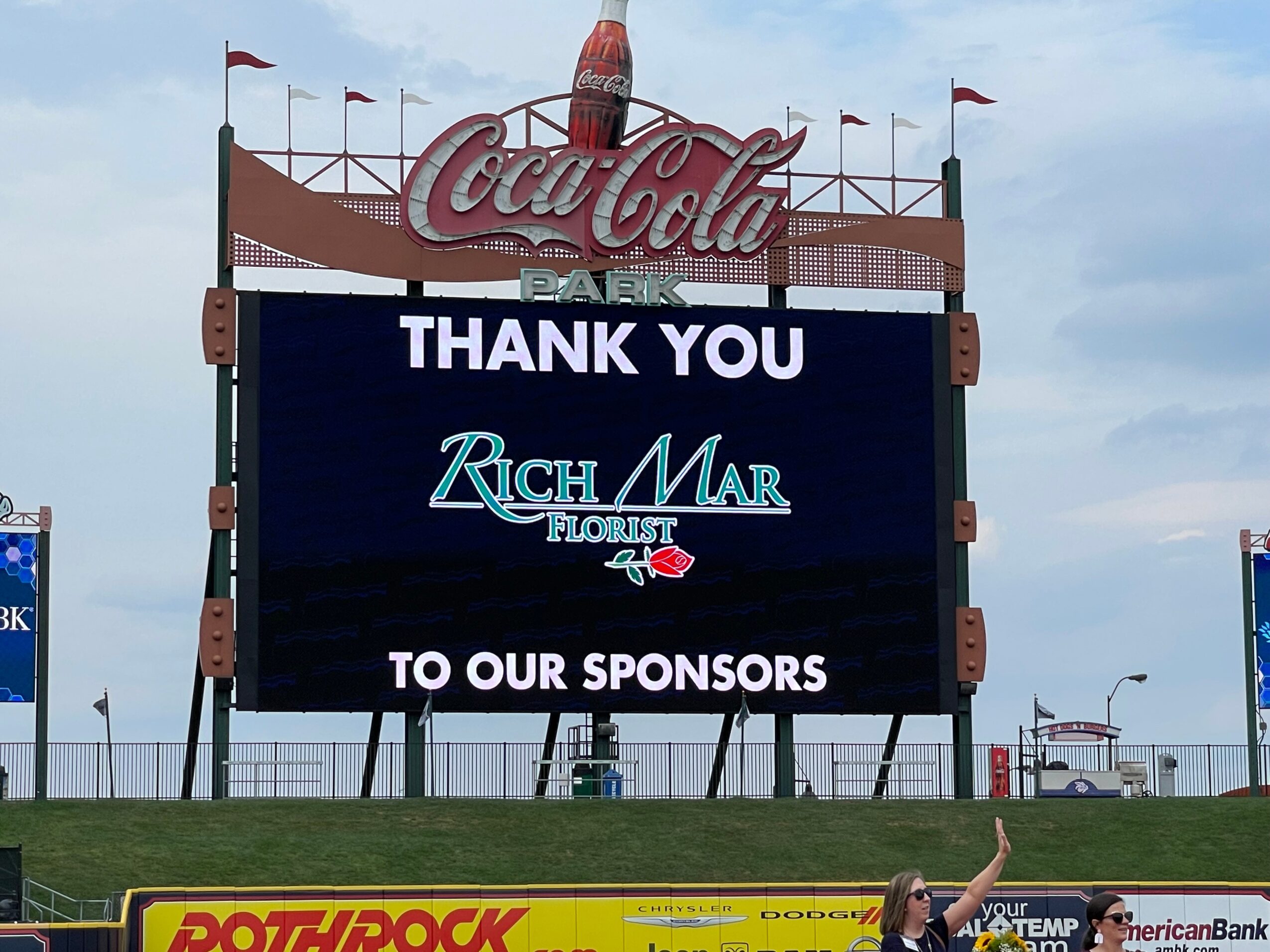 Electronic scoreboard displaying 'Thank You' and sponsor logos at a sports event.