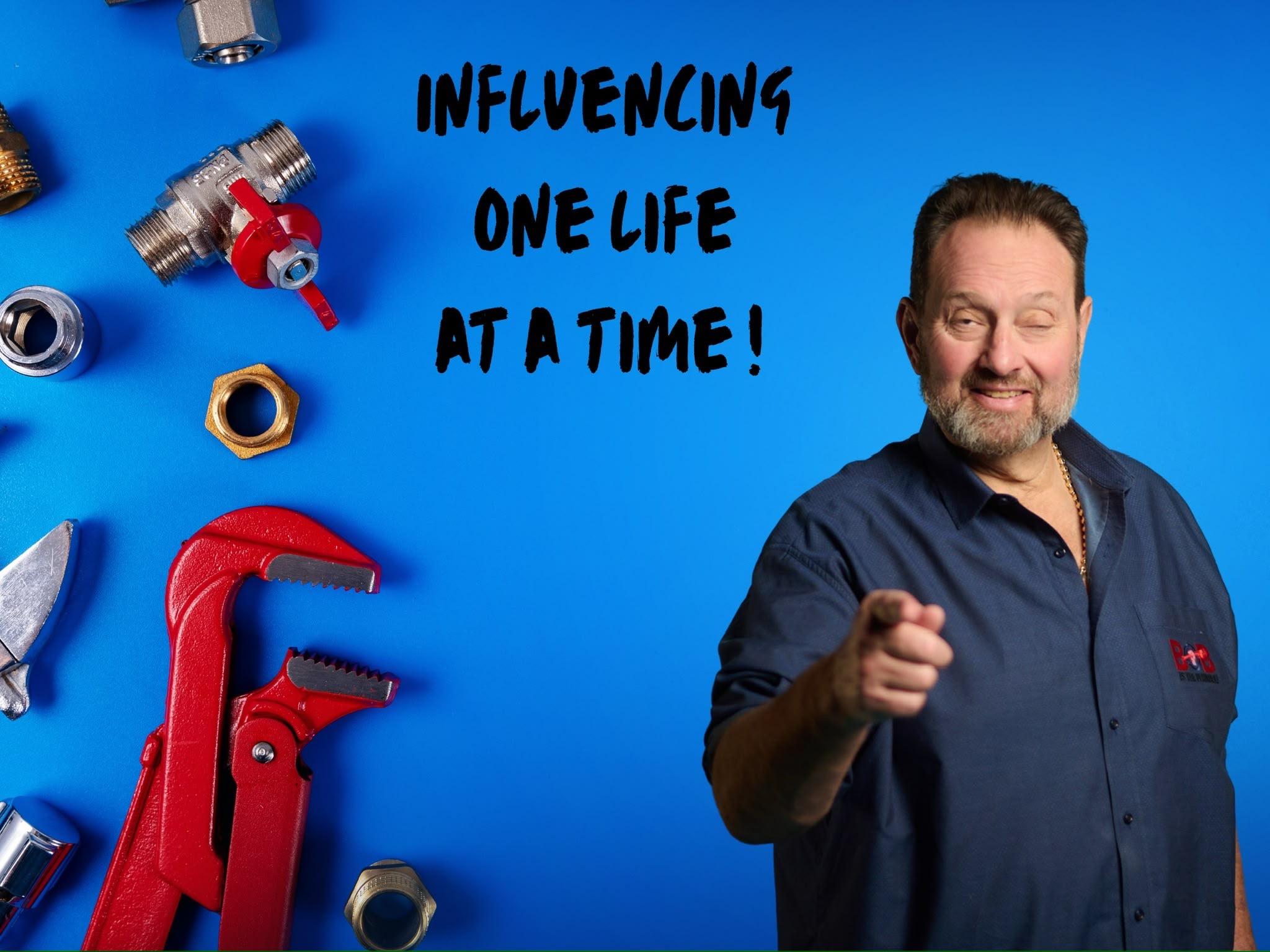 Man with a beard and dark shirt pointing at the camera, blue background with tools and text about influencing one life at a time.