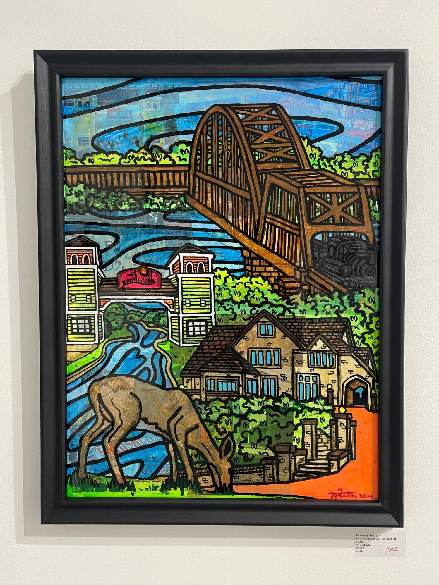 Colorful stained glass scene of a bridge over a river, a house, a dog, and lush greenery.