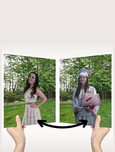 Two women holding a mirror-like object reflecting a woman in a dress and a woman in a graduation cap and gown outdoors.