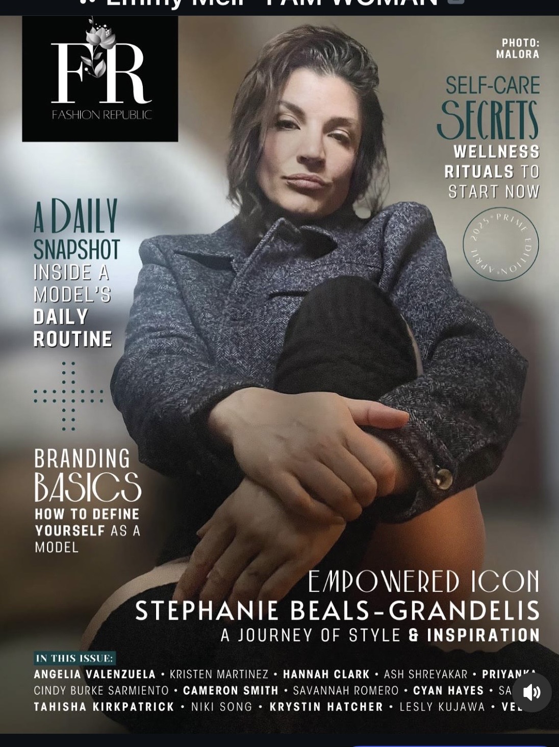 Woman with shoulder-length hair wearing a dark sweater, sitting with arms crossed, on magazine cover.
