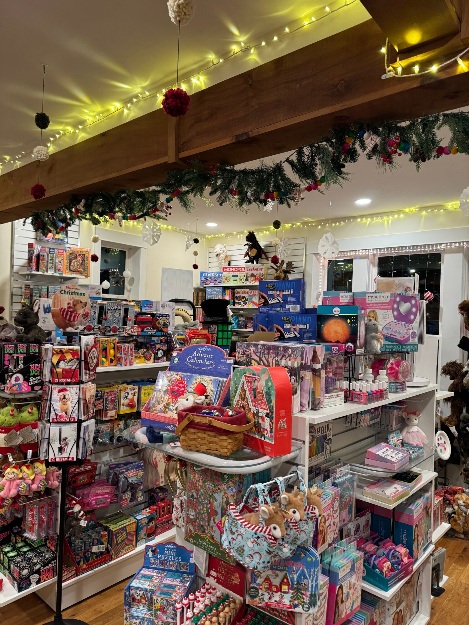 Christmas decorations and gift displays in a store with holiday-themed items and lights.