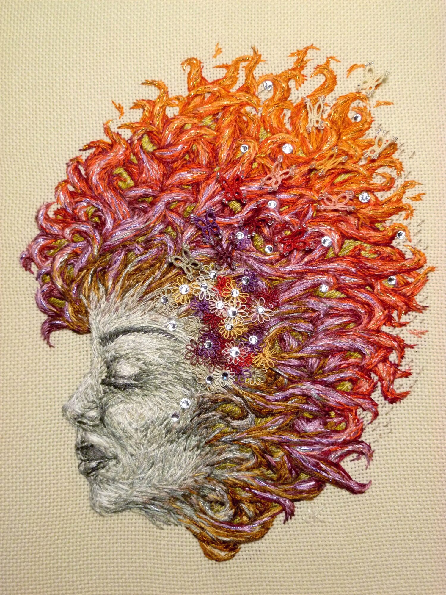 Portrait of a person with closed eyes and curly hair blending into a starry, colorful background.