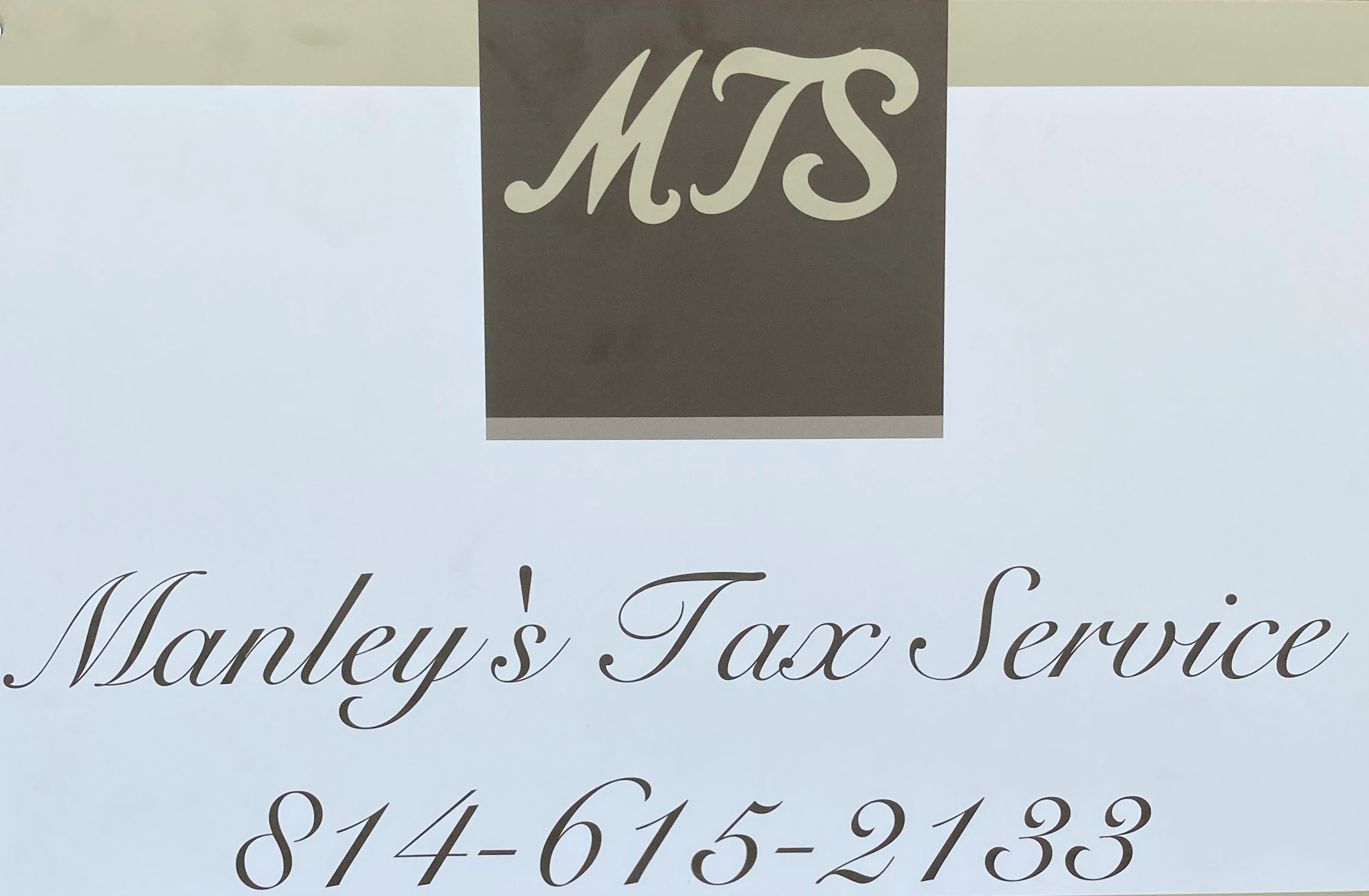 Sign with MTS logo and text for Manley's Tax Service, including phone number.