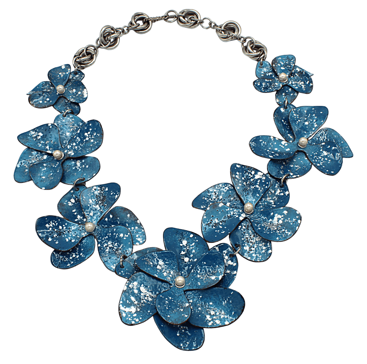 Blue flower-shaped necklace with glitter and pearl centers on a black background.