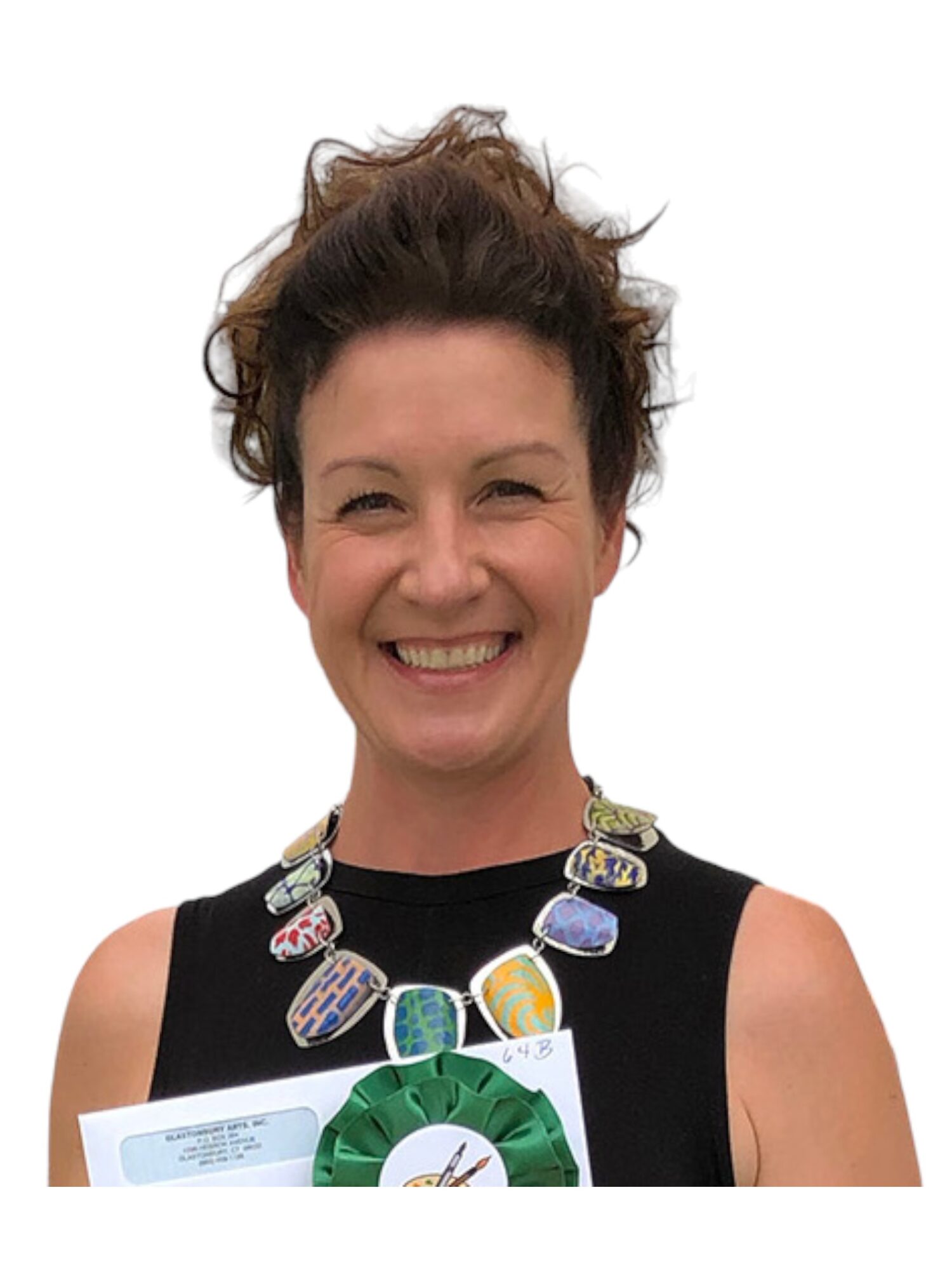 Smiling woman with short, curly hair wearing a black sleeveless top and a colorful statement necklace.