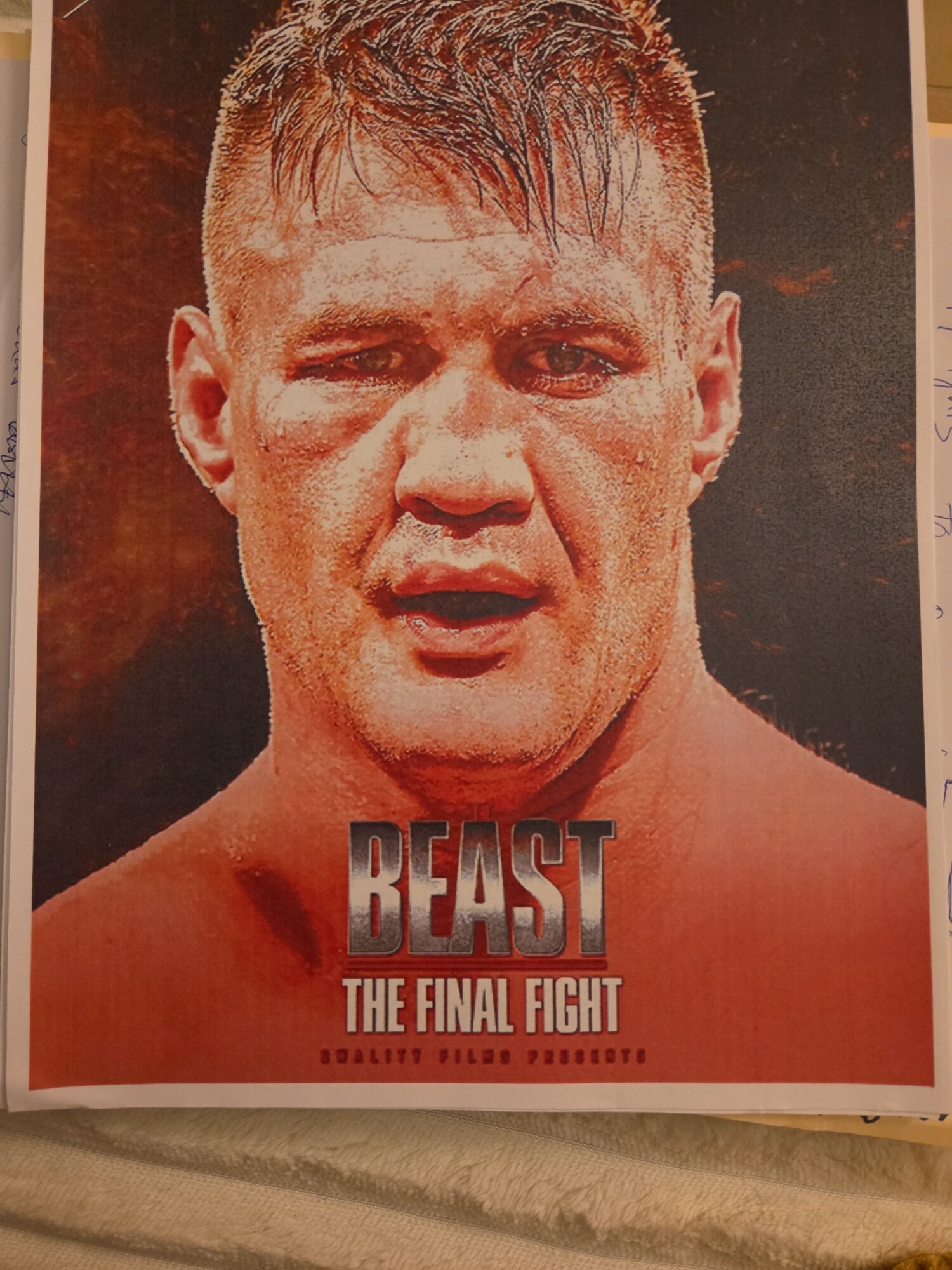 Close-up of a male fighter's face with short hair, intense expression, and a bare shoulder, promoting a fight event.