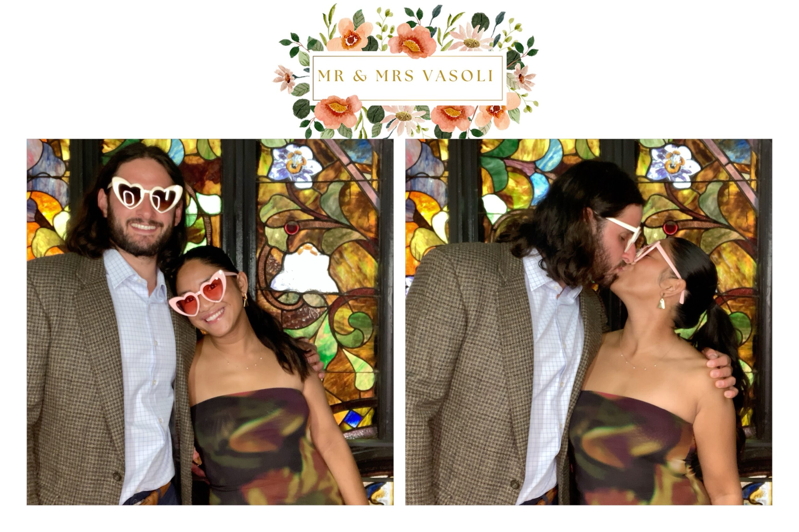 Two people in front of stained glass, one wearing glasses, the other with long dark hair, embracing and kissing.