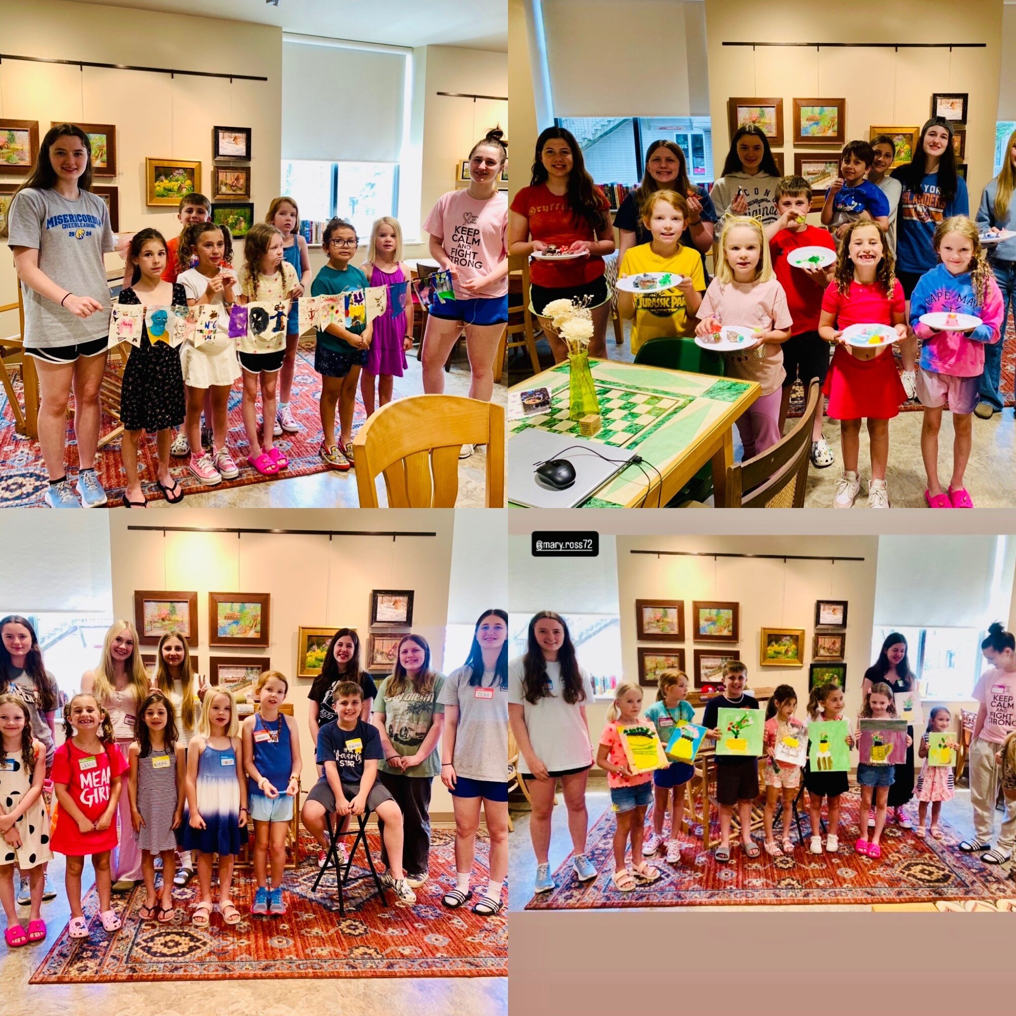Group of children and adults in an art gallery, some holding plates, with artwork on walls behind. Bright room, colorful scene.