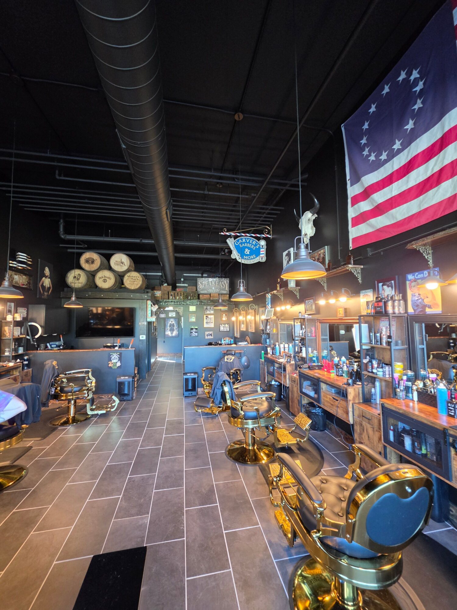 Store interior with American flag, shelves, and various items, viewed from a tilted angle.