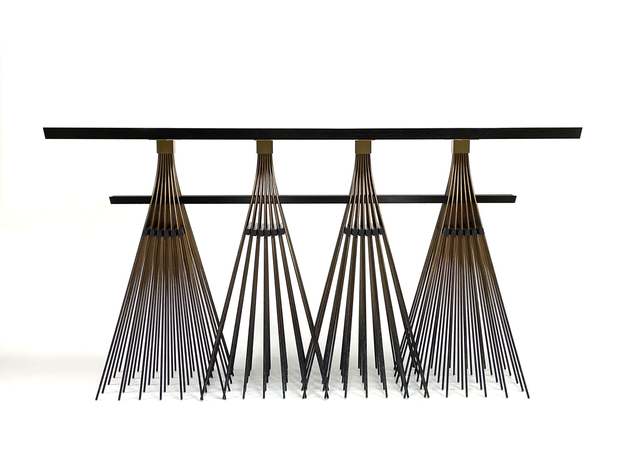 A black table with four wooden cone-shaped objects underneath, arranged in a row, against a white background.