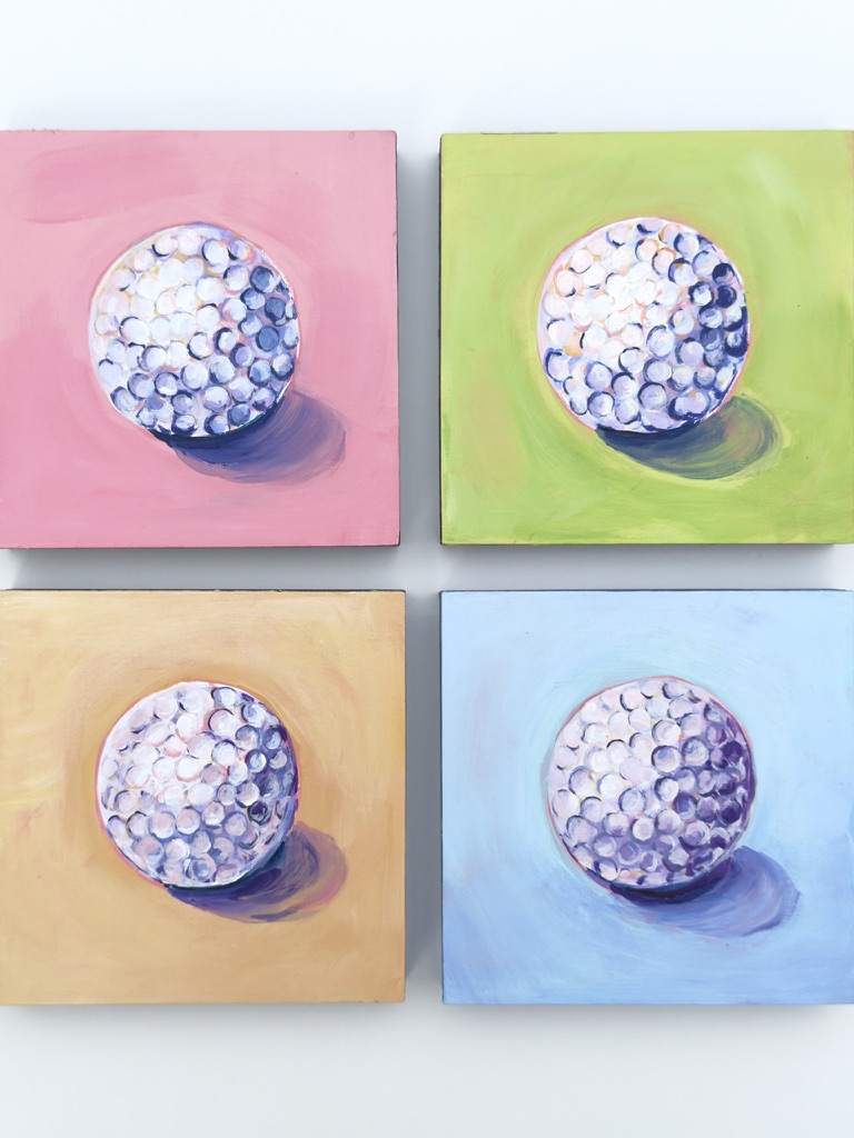 Four colorful square paintings each featuring a spherical object with a shadow, arranged in a 2x2 grid.