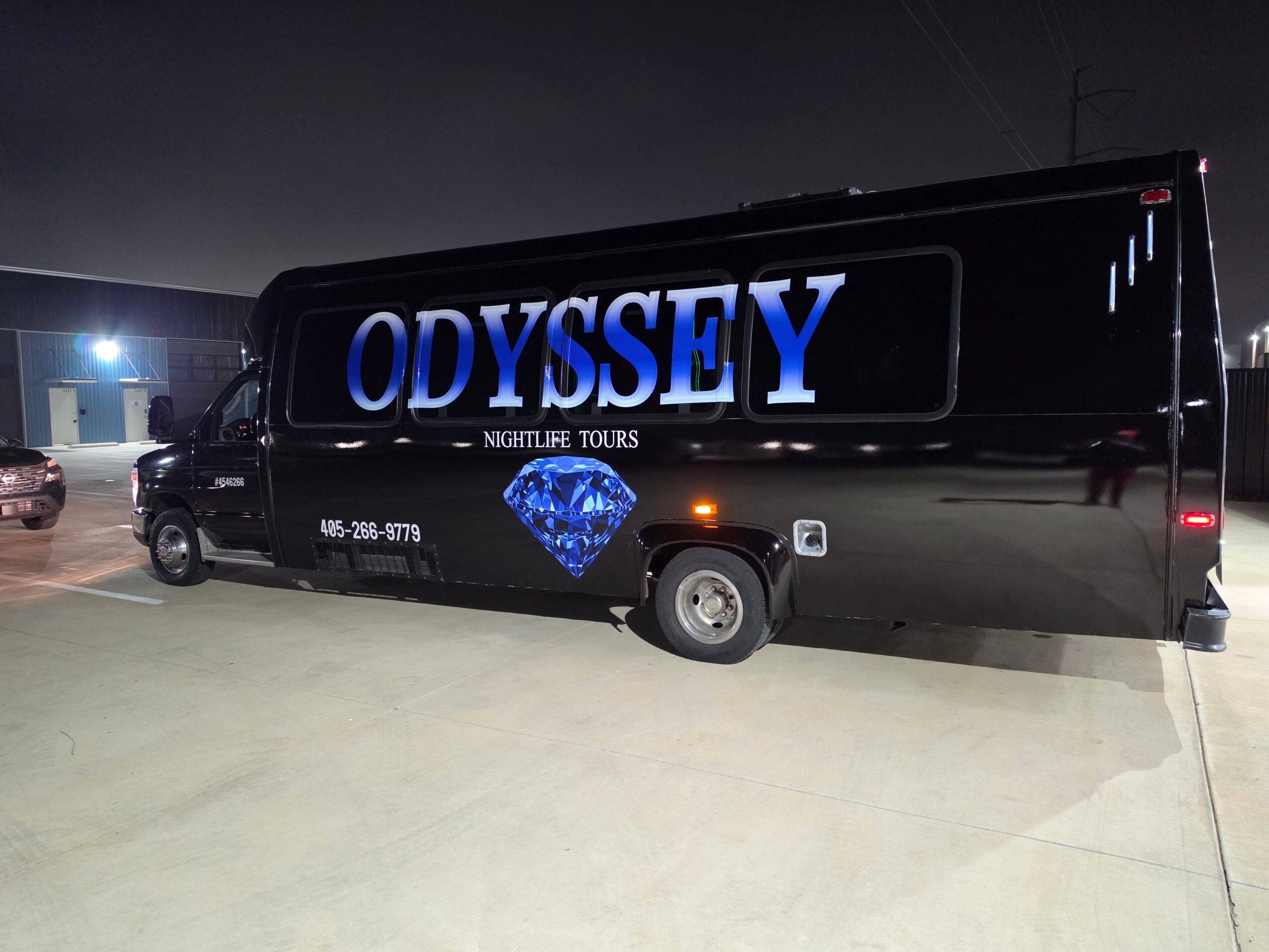 Black tour bus with large blue