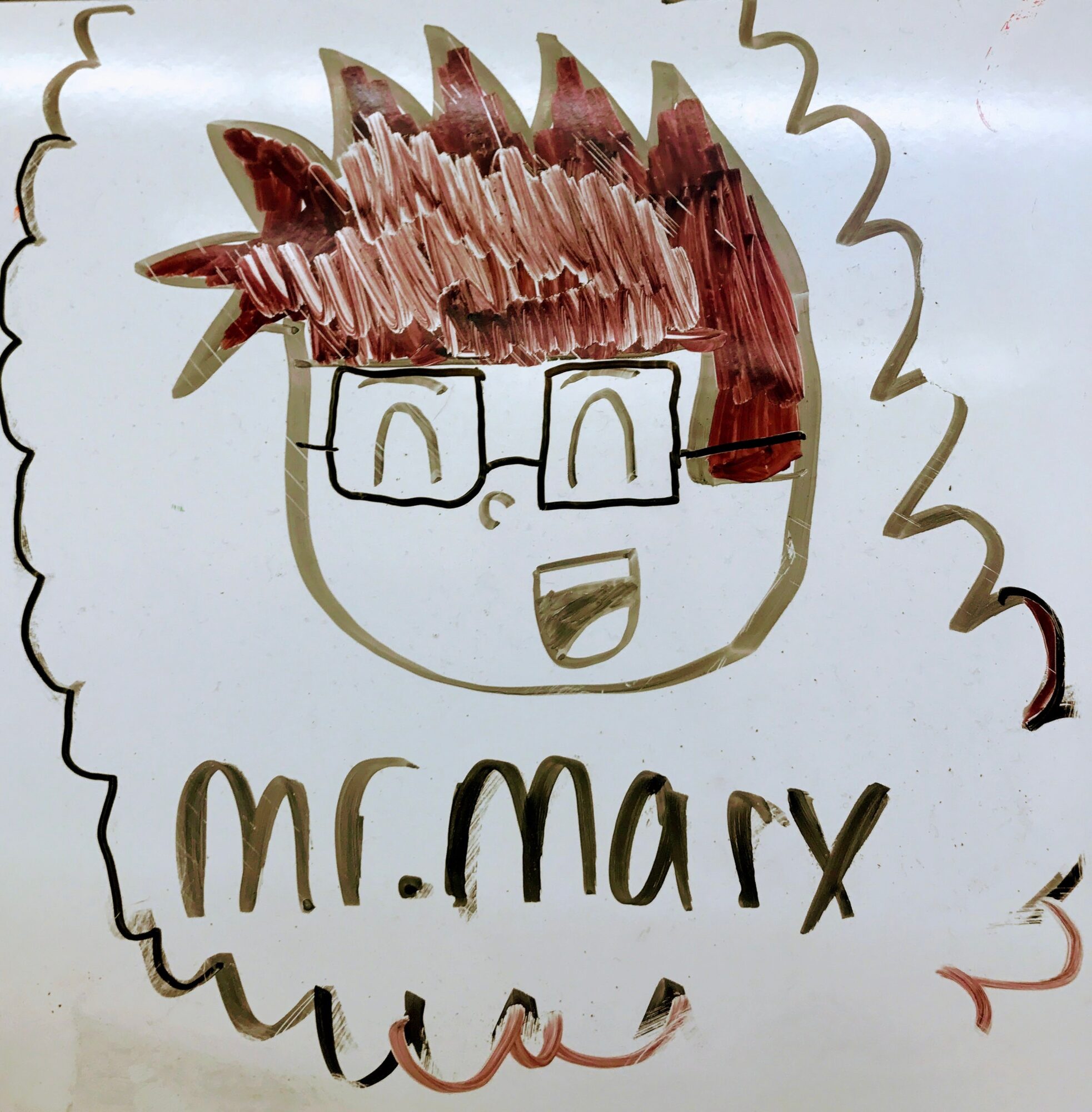 Drawing of a person with glasses and spiky hair, smiling, with the text 'mr. mary' below.