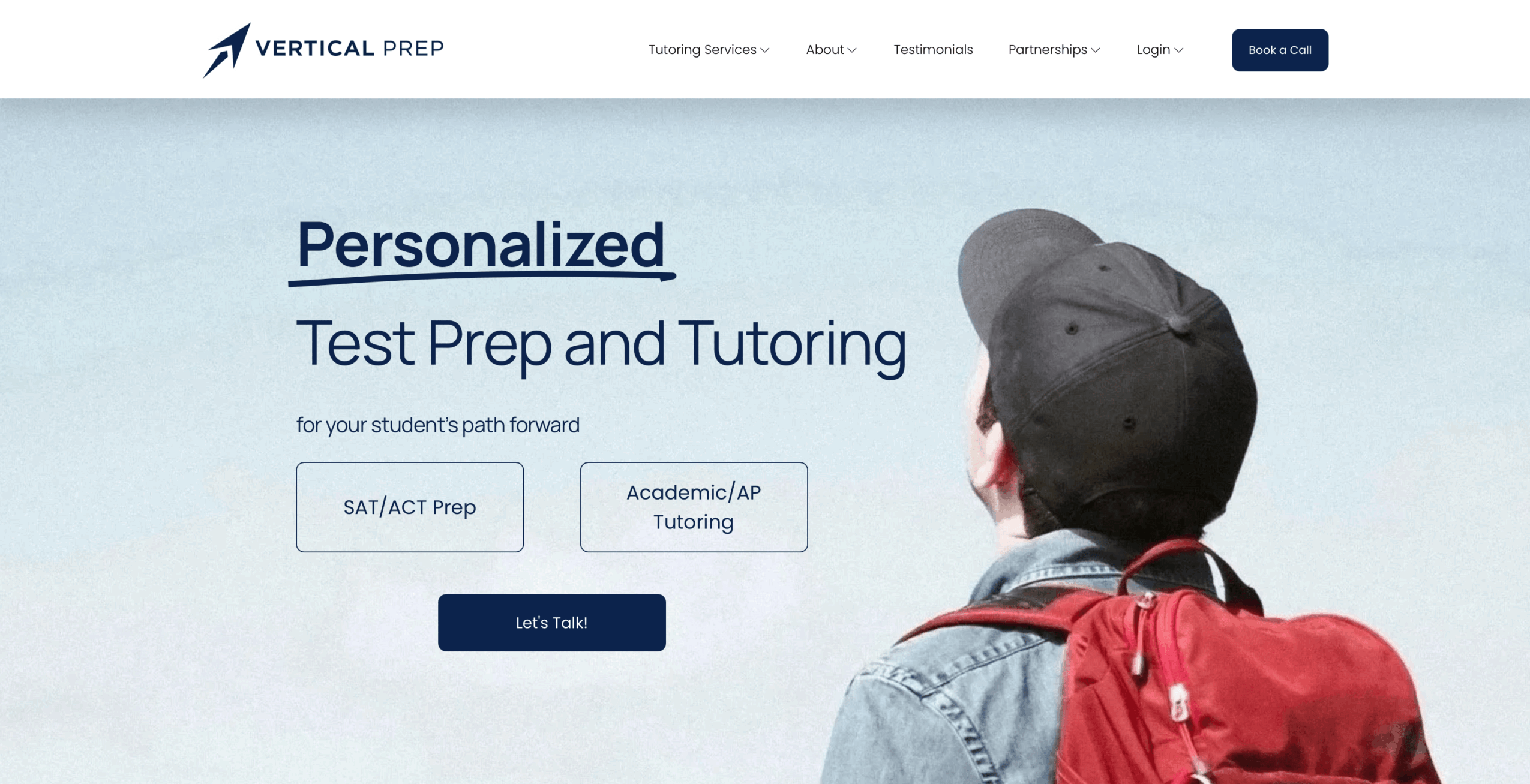 Person with a backpack looking at a website about test prep and tutoring services.